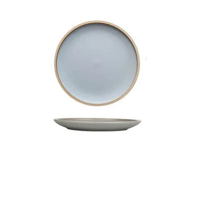 Blue matte ceramic plate with sesame point glaze on a table, 10 inch diameter.