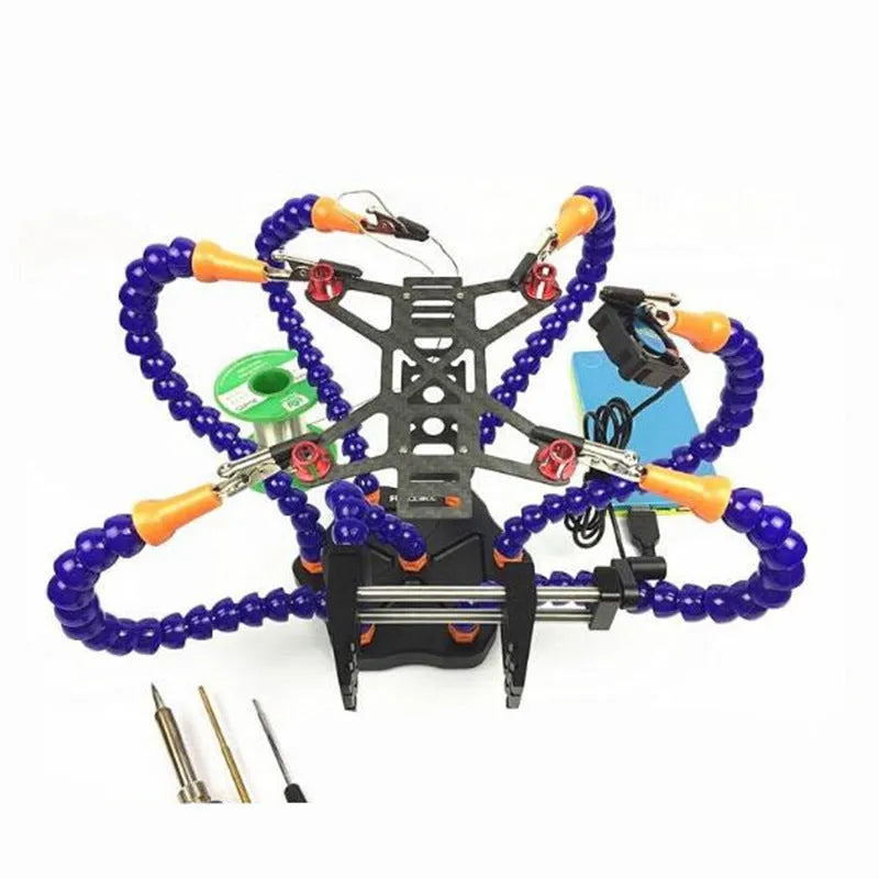 Black aluminium six-claw welding station with seven adjustable arms and rotating chucks on a workbench.
