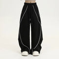 Black pleated wide-leg hip hop sports trousers with a striped pattern.