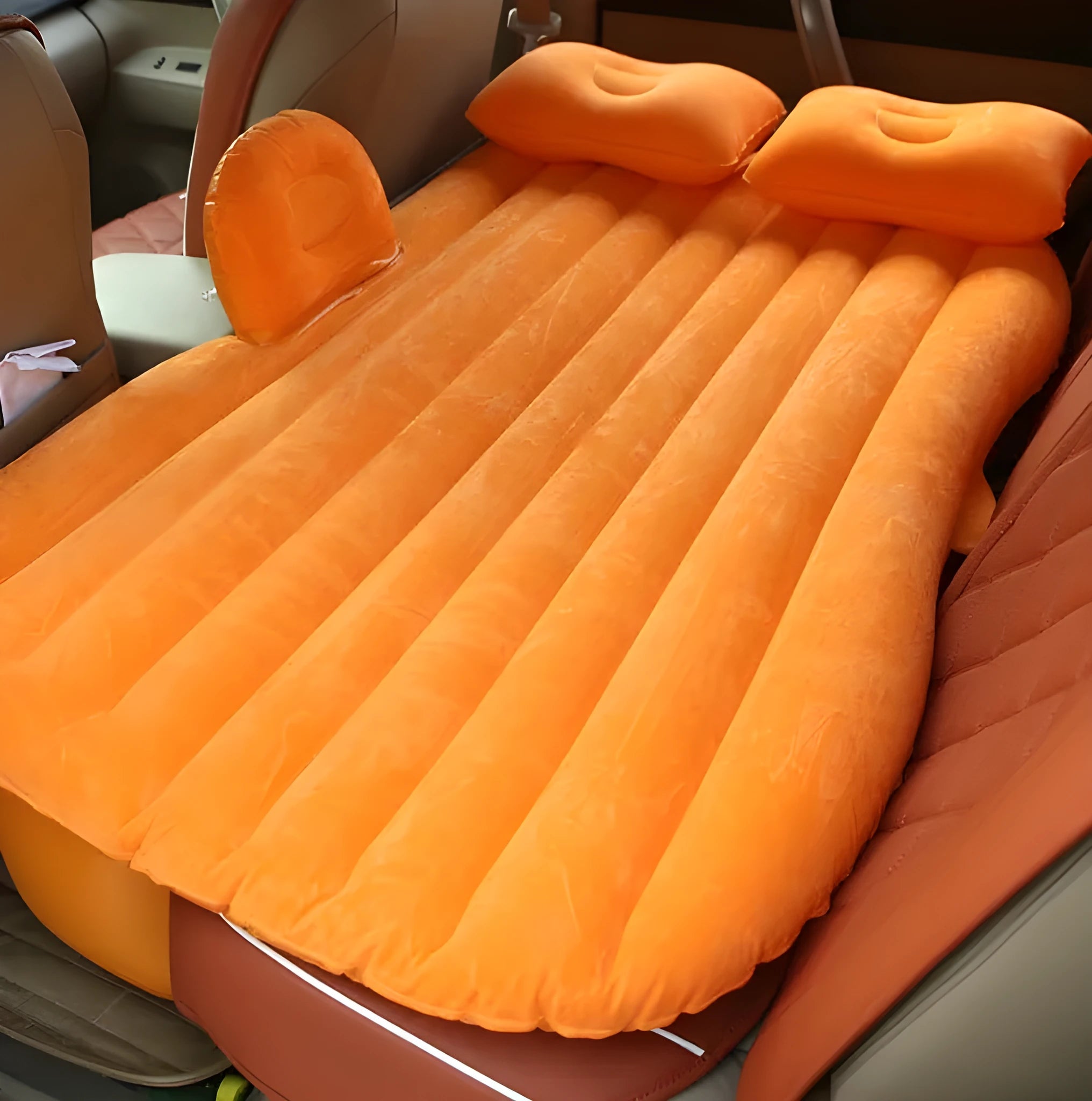 Car inflatable bed with 0.5mm flocking cloth in black wave, including pillows and pump, set up in a car rear seat