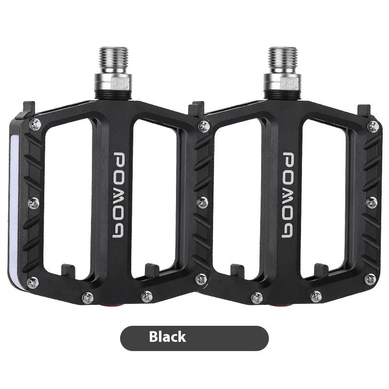 Pair of aluminium alloy bicycle pedals with integrated 710LED lights in black finish
