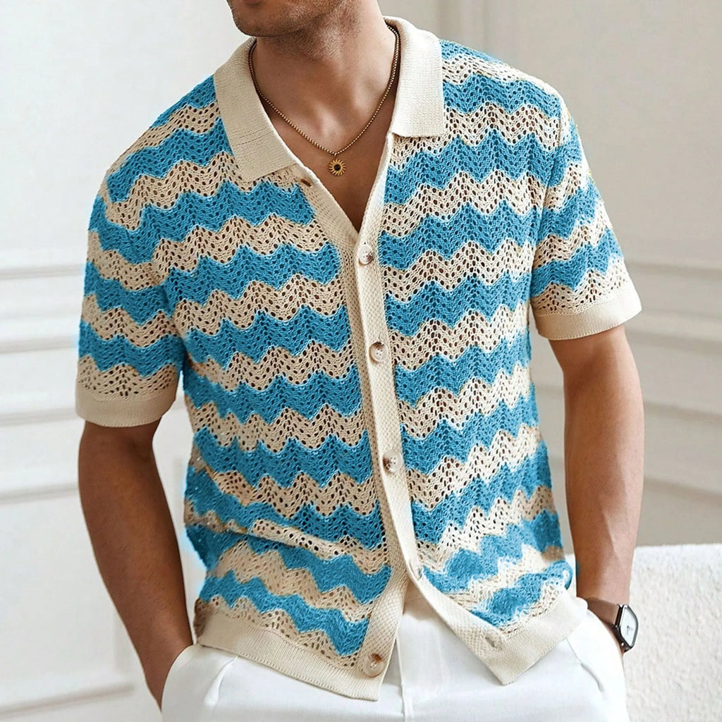 Blue short-sleeve sweater with textured hollow jacquard corrugated pattern and flocking details on a mannequin.