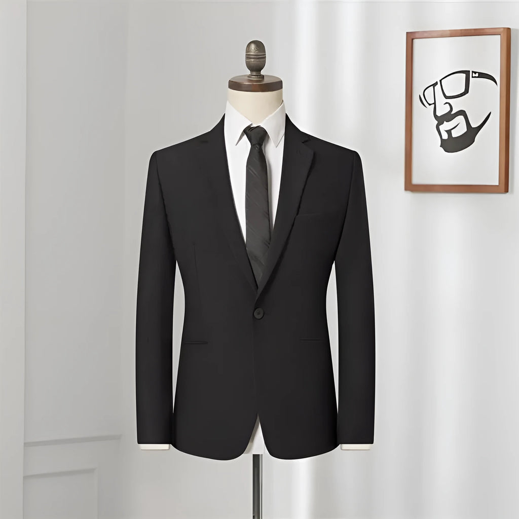 Men's black slim-fit one-button business suit with flat collar and rear slit on a hanger.
