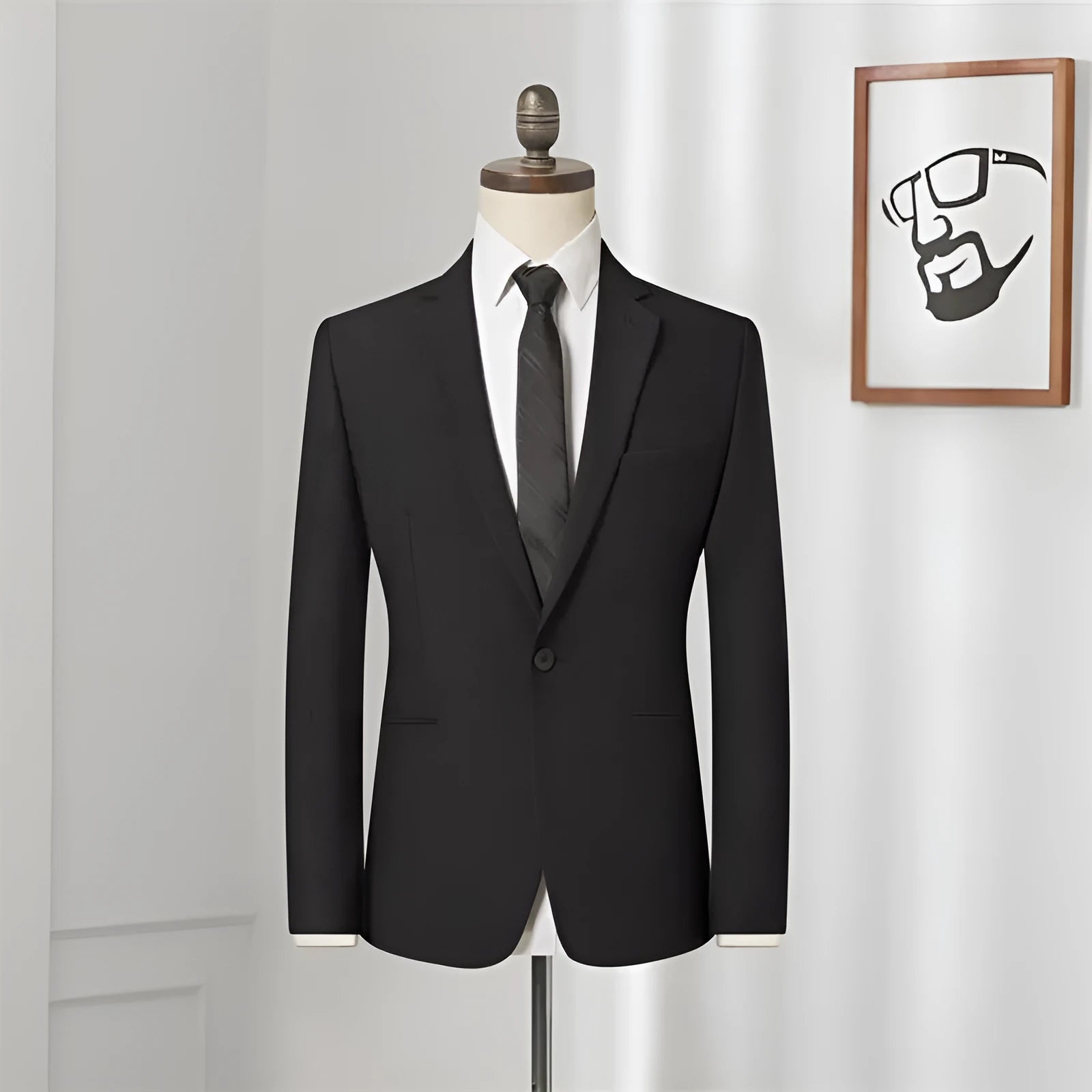 Men's black slim-fit one-button business suit with flat collar and rear slit on a hanger.