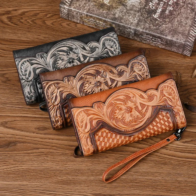 Chinese style embossed leather wallet in tri-fold design showing floral pattern on brown cowhide