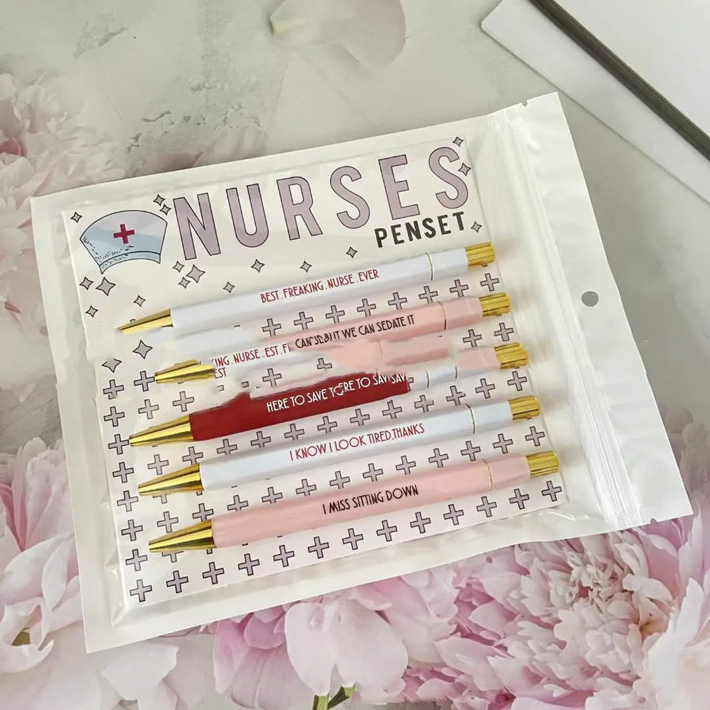 Set of five blue and pink nurse-themed retractable ballpoint pens on a white background.