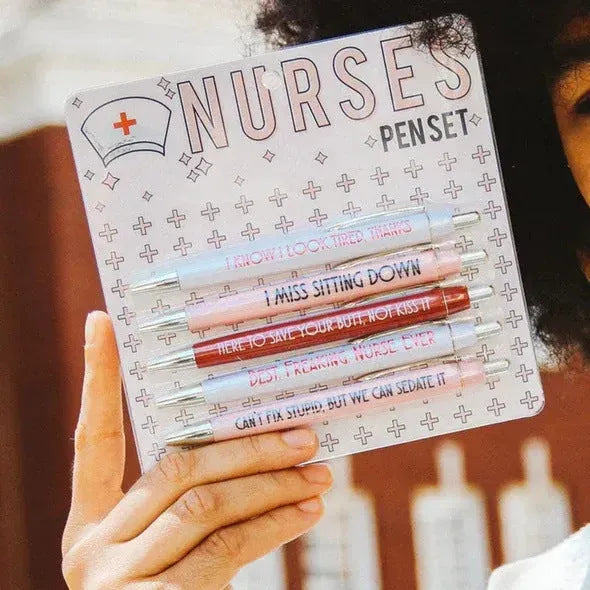 Set of five blue and pink nurse-themed retractable ballpoint pens on a white background.