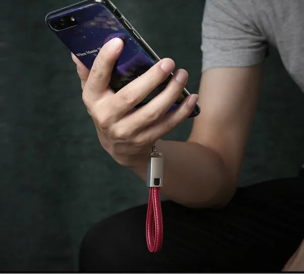 USB to Apple Lightning charging cable with leather braiding and zinc alloy connector in black, brown or red colours