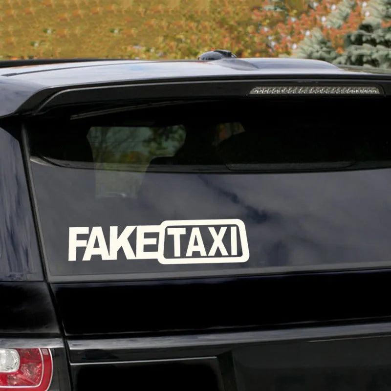 Black waterproof PET car sticker with white FAKE TAXI text, measuring 20 cm by 8 cm.