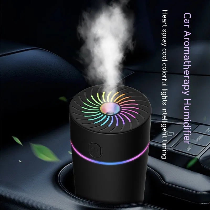 Black and white USB car humidifier with aromatherapy function on a car dashboard