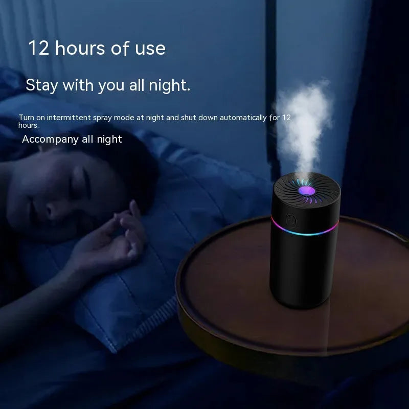 Black and white USB car humidifier with aromatherapy function on a car dashboard