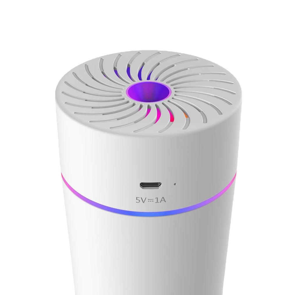 Black and white USB car humidifier with aromatherapy function on a car dashboard