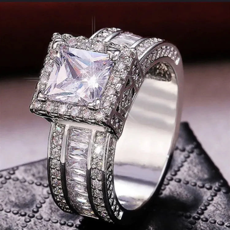 Silver-plated geometric women's ring in gold or white electroplated finish showing angular design with round elements