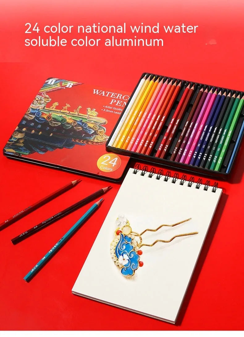 Metal tin box open to show 24 wooden water-soluble coloured pencils in assorted colours.
