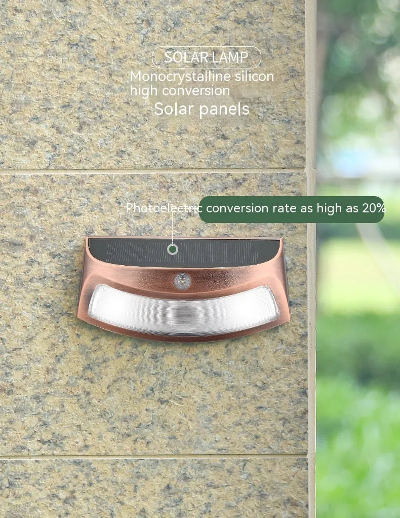 Solar outdoor garden wall lamp with smiling face design for courtyard lighting