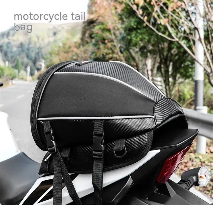 Black motorcycle fuel tank bag with reflective stripe, 15-litre capacity, mounted on a motorcycle seat