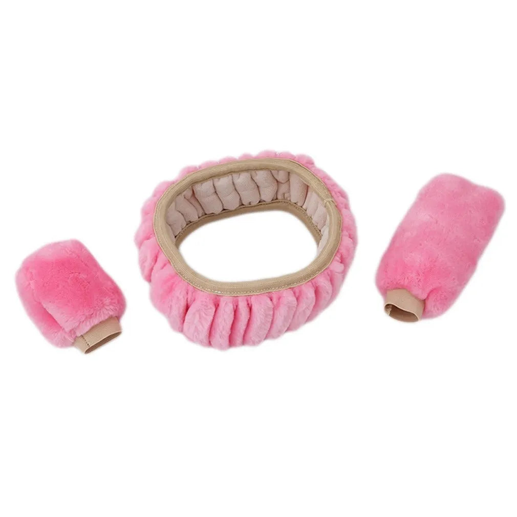 Winter plush car steering wheel cover set in black with matching gear shift and handbrake covers on a dark car interior
