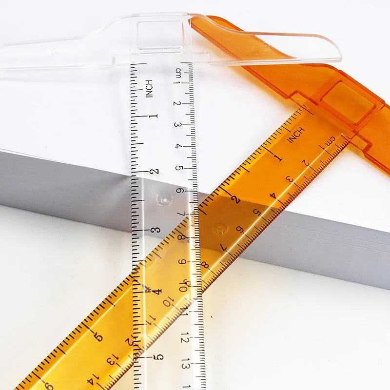 Transparent plastic T-shaped technical drawing ruler showing British centimetre graduations