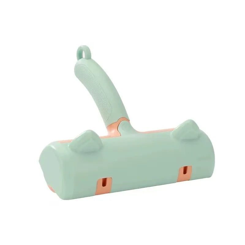 Mint green cat hair removal brush with ear style design on a light background