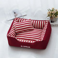Navy stripe washable dog kennel mat with removable cover and matching mini pillow on a light background