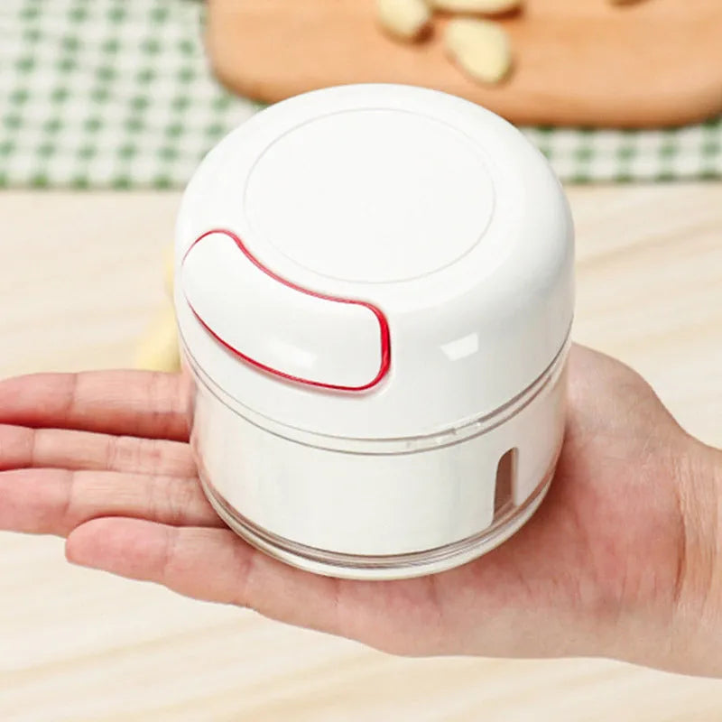 White manual food chopper with 304 stainless steel blades and magnetic attachment, 8.5 x 7 cm size