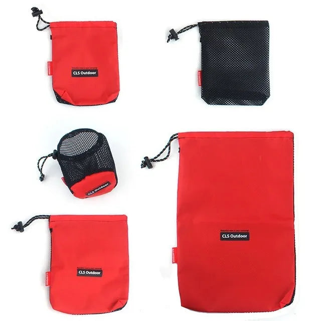 Five red outdoor storage bags with mesh panels and zipper closures for travel organisation
