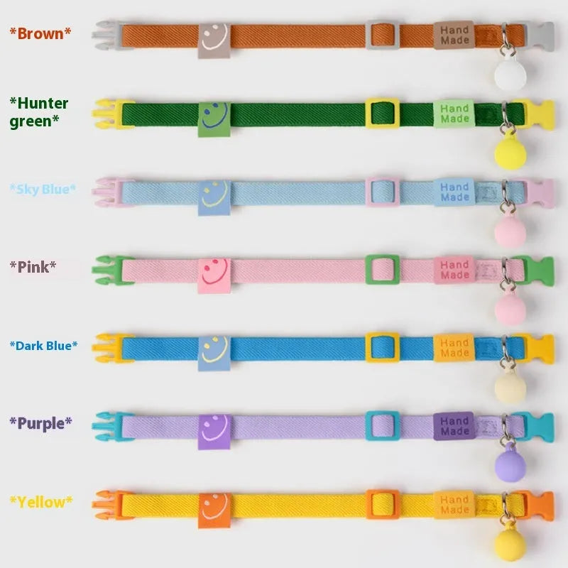 Small elastic dog collar in polyester, shown in various colours including yellow, pink and sky blue.
