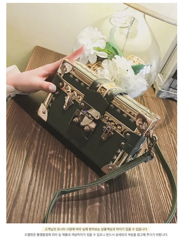 Hard-structured women's black PU leather shoulder bag with flap and rivet decoration