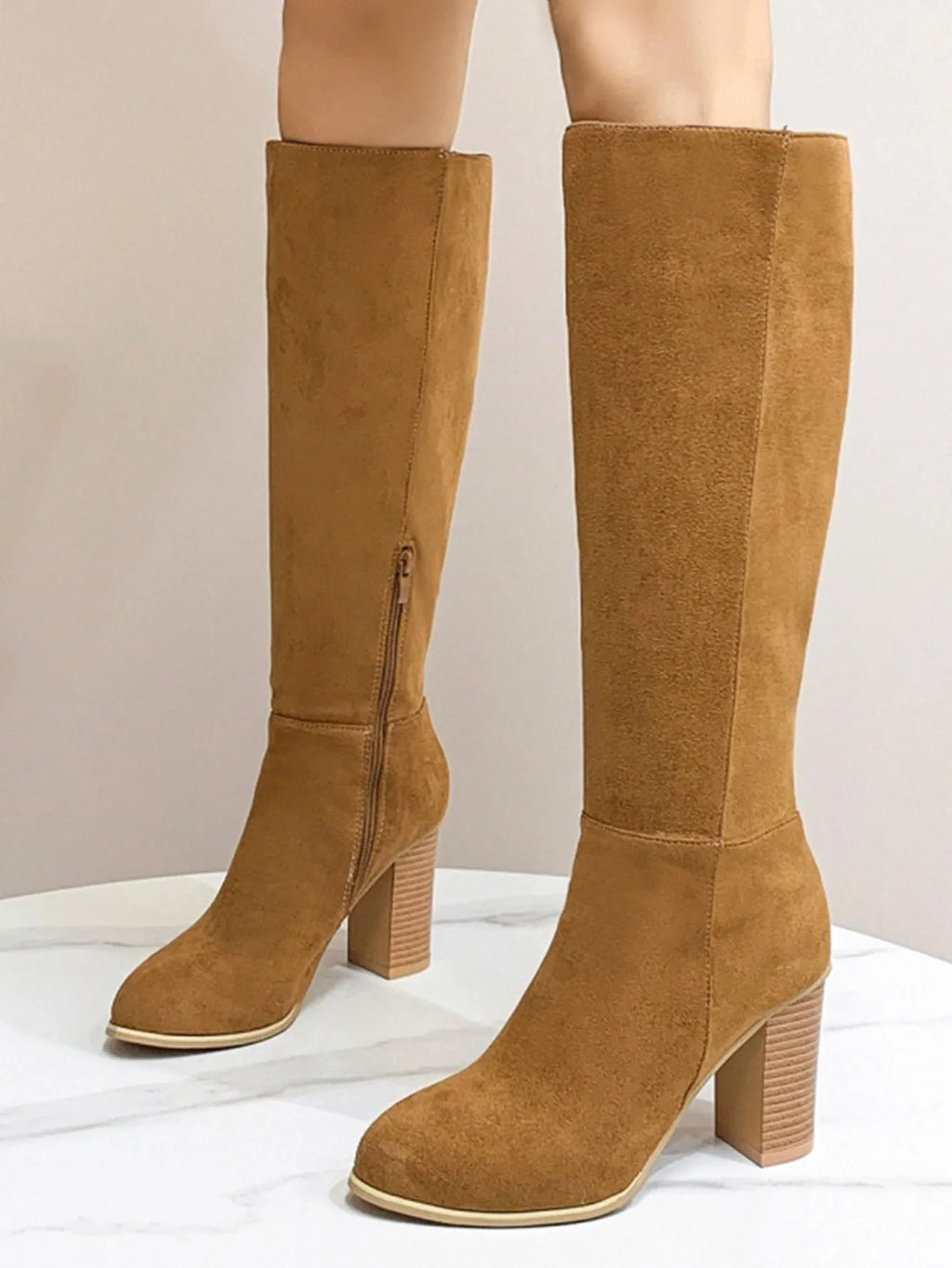 Women's black square toe high heel fashion boot made from artificial PU material.