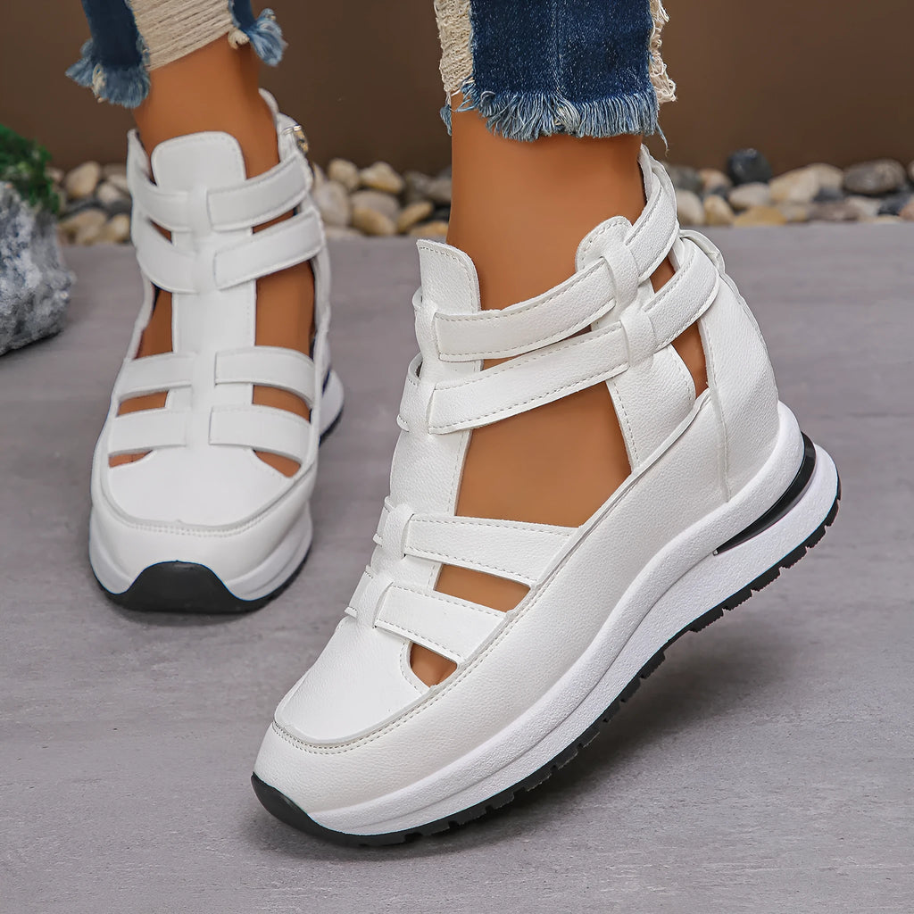 Women's black close-toed platform sandals with hollow-out design and Velcro strap.