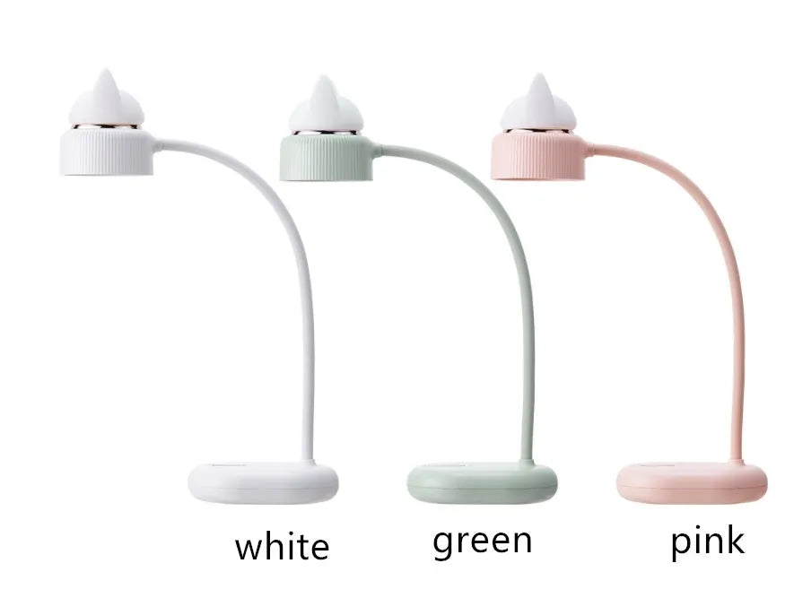 White clip-on LED desk lamp with built-in lithium battery and touch switch on a desk