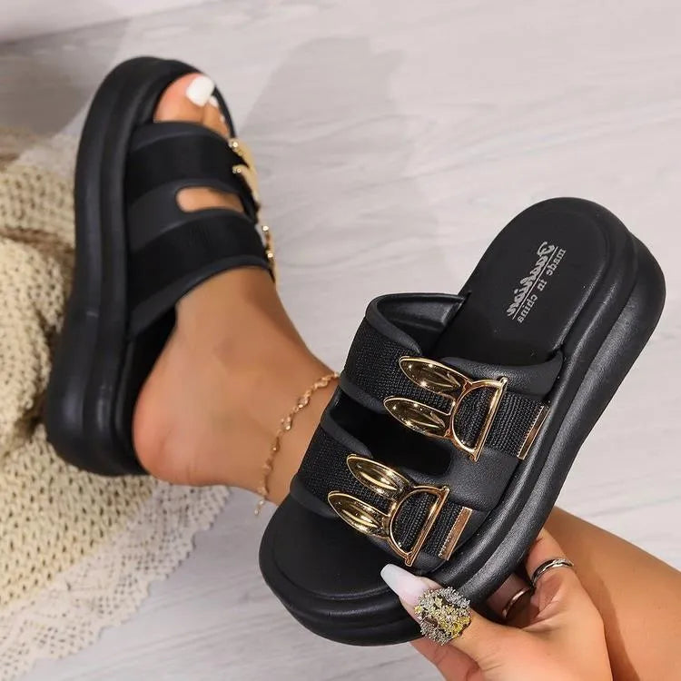 Women's apricot suede slippers with a thick light-coloured rubber sole, shown from the side.