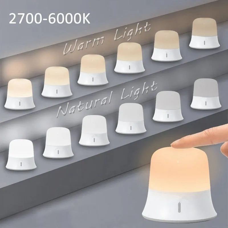 White touch-control bedside night light with RGB colour changing on a wooden table.