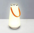 White LED rechargeable night light on a bedside table, 12x12x22cm ABS plastic body with warm glow