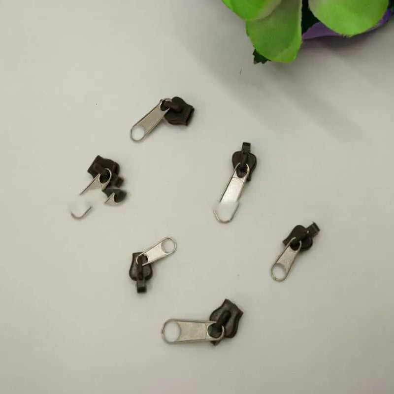 12-piece zipper head repair kit in black, black grey, and coffee with plastic and metal construction