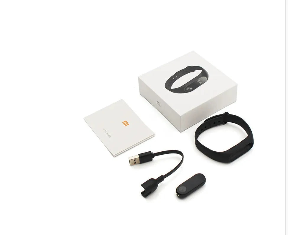 Xiaomi Mi Band 2 black smart fitness tracker with OLED touchscreen display on a wrist.