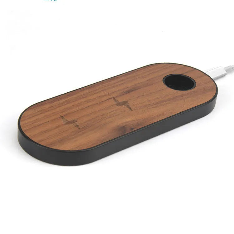 Wooden wireless charger with natural bamboo surface and walnut edging on a desk