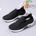 Women's black mesh lace-up sneakers with a soft sole on a white background.