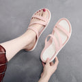 Women's solid colour casual sandals on a beach background, showing red, blue, and black colour options.