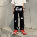 Men's American retro printed casual trousers with button placket and small straight leg in graphic colour