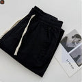 Men's loose straight casual pants in beige colour with drawstring waistband