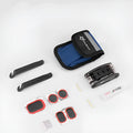 Portable bicycle tire repair kit in storage pouch mounted on upper tube of bike frame, with maintenance tools visible