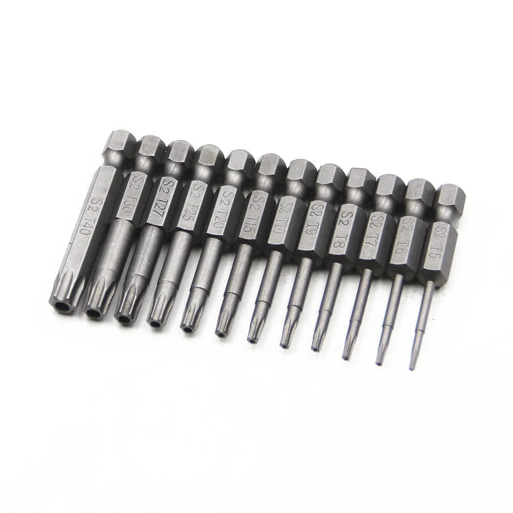 Alloy hexagon handle screwdriver bit set with plum blossom hollow bits in 50mm, 75mm, and 100mm lengths on a workbench