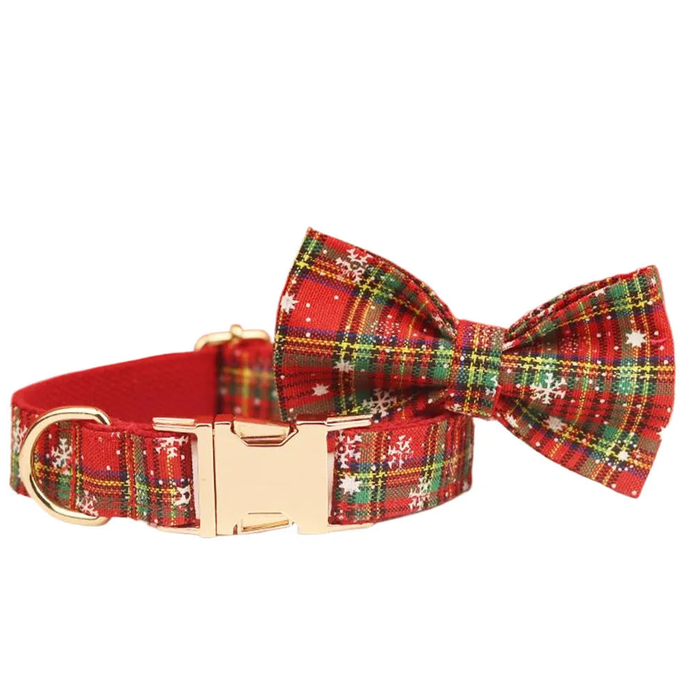 Red background snowflake plaid Christmas pet collar leash set with bowknot flowers and dog vest on a small dog