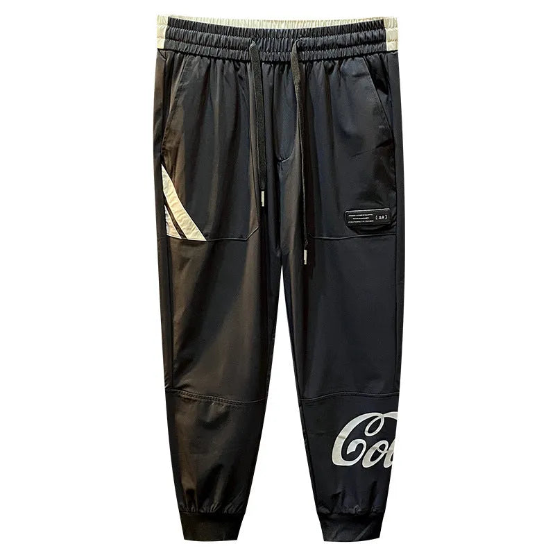 Men's black ultra-thin ice silk ankle banded cropped casual trousers on hanger