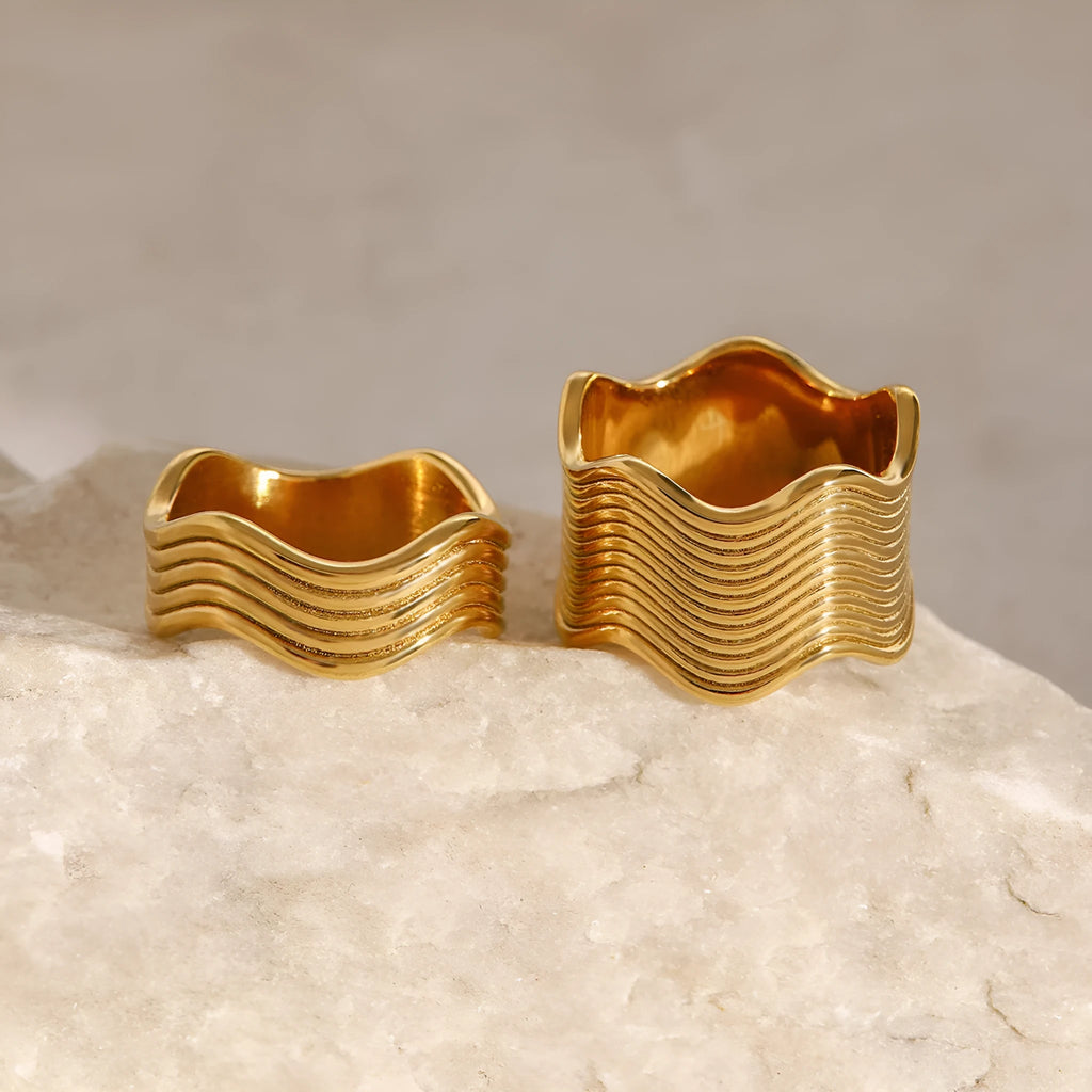 Stainless steel wide band finger ring with a geometric wave pattern, electroplated finish.