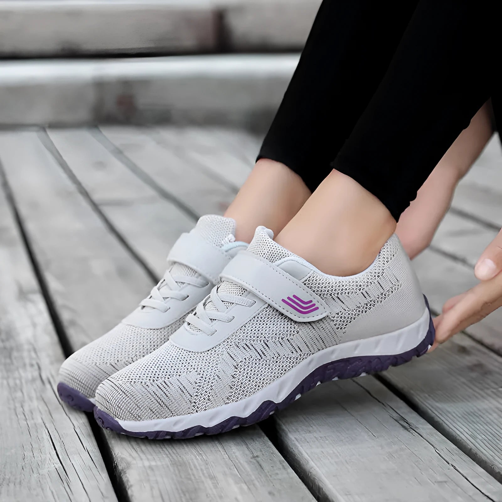 Women's grey purple low top wedge heel shoes with velcro strap and mesh upper.