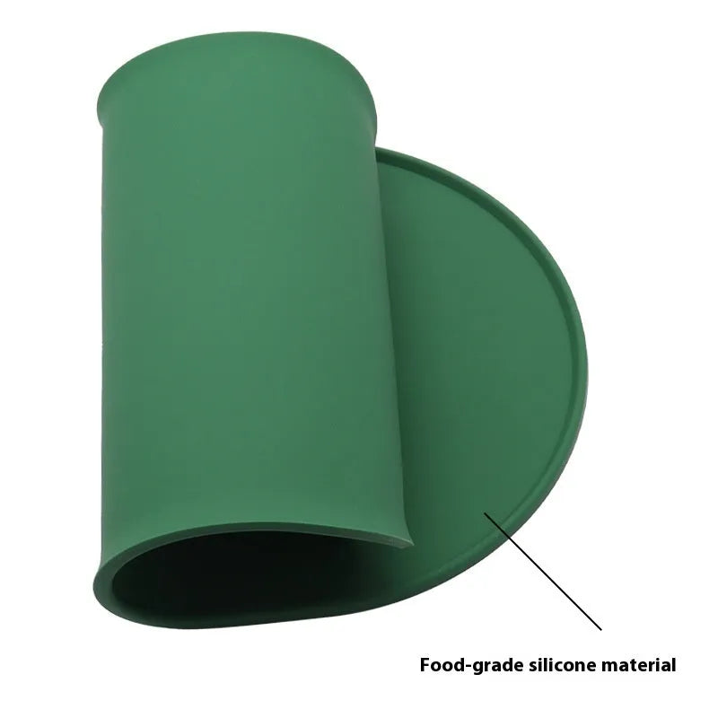 Silicone waterproof placemat for cat food and water bowls in beige, showing its size next to a bowl.