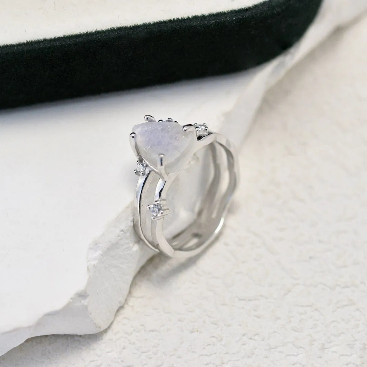 S925 silver ring with irregular triangle shape and moonstone in rose, white, or yellow gold finish.