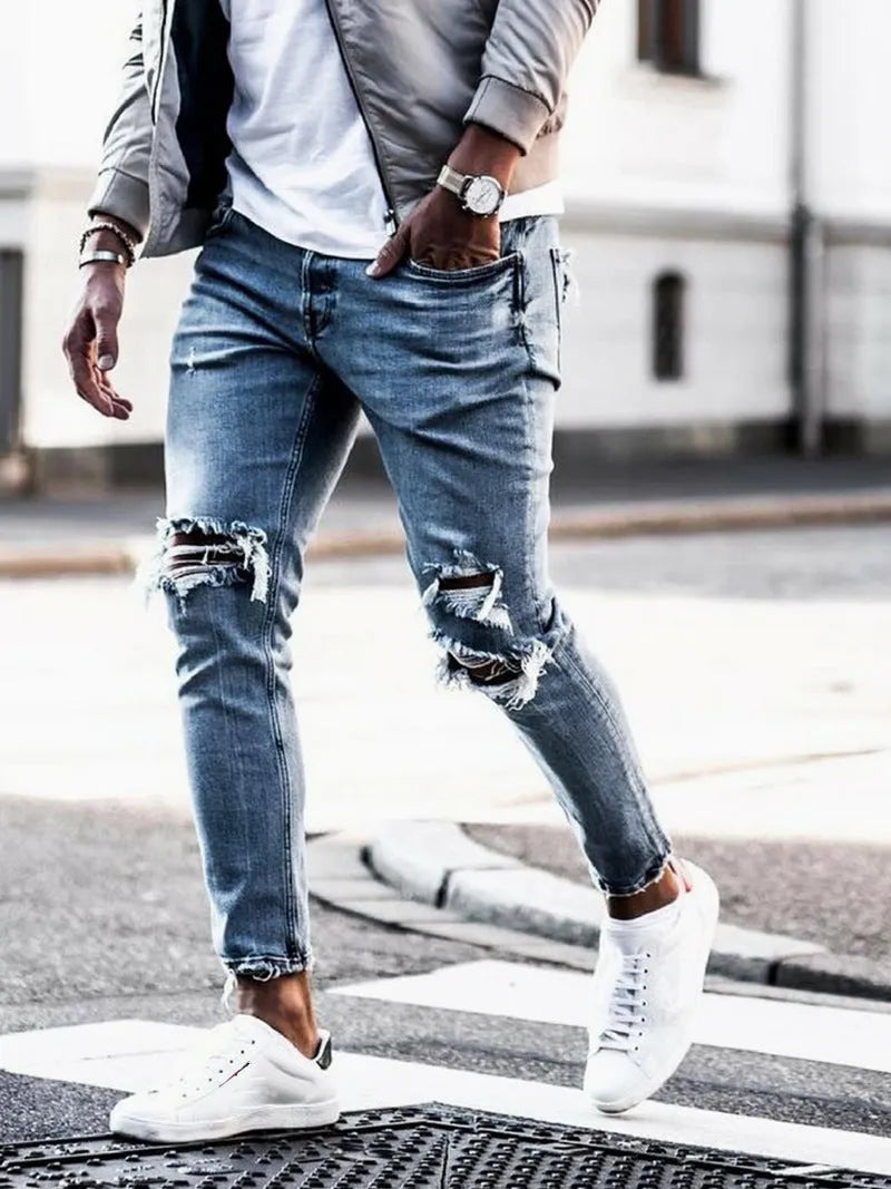 Men's light blue straight fit jeans with worn and embroidered detailing, five-point length, mid-rise waist